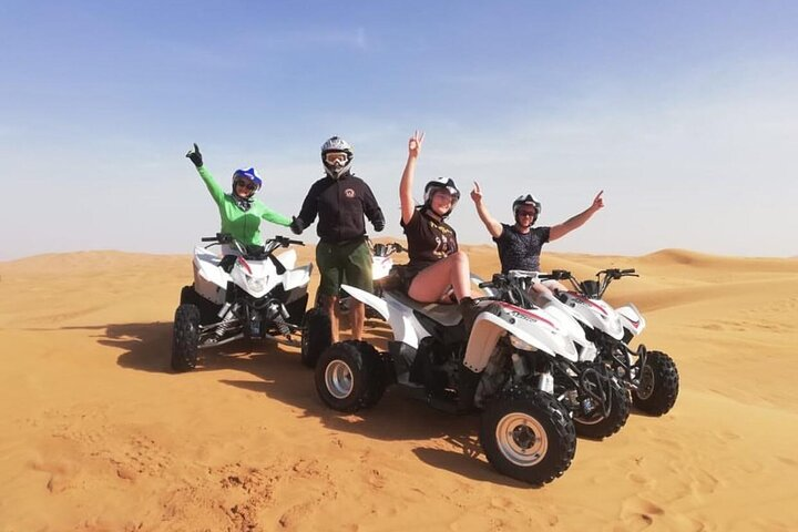 Experience the beauty of the Rub Al Khali desert while riding quad bikes enjoy traditional activities and connect with the welcoming spirit of Dubai’s rich heritage under the desert sun.